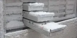 Freezer of samples with sample drawers open and coated in frost