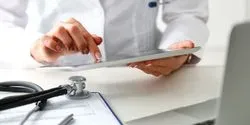 Two hands holding a tablet