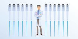 Daniel the Clinical Lab Guy stands smiling among a row of pipettes