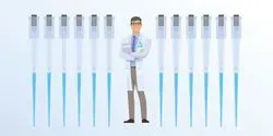 Daniel the Clinical Lab Guy stands smiling among a row of pipettes