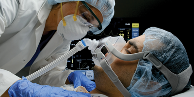 doctor treating patient with severe COVID-19