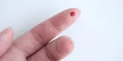 finger prick for COVID-19 blood spot test