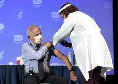 Dr. Anthony Fauci, Director of the National Institute of Allergy and Infectious Diseases, receives the Moderna COVID-19 vaccine at the HHS/NIH COVID-19 Vaccine Kick-Off event at NIH on 12/22/20
