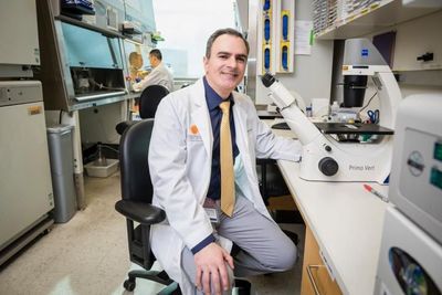 A photo of Ralph DeBerardinis, M.D., Ph.D. in his laboratory