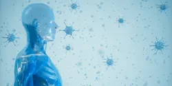 Illustration of a human surrounded by coronavirus particles