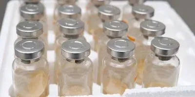 A cold storage container with full of glass vaccine vials