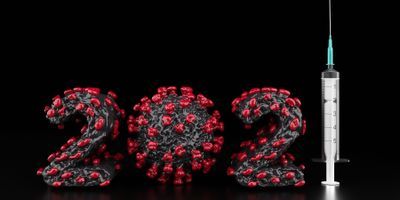 A coronavirus virus vaccine syringe next to an illustration of the coronavirus