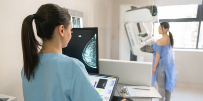 Photography of a women undergoing mammography in a hospital