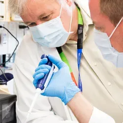 Jeff Wrana is seen leaning over a laboratory bench at the Lunenfeld-Tanenbaum Research Institute in Toronto, Canada