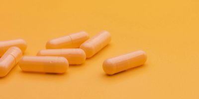 Photo of a fecal microbiota transplant capsule containing beneficial gut bacteria.