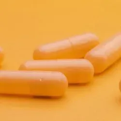 Photo of a fecal microbiota transplant capsule containing beneficial gut bacteria.