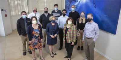 A group photo of scientists from UC Davis and Maurice J. Gallagher, Jr.,