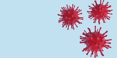 Illustration of three red coronavirus particles on a light blue background