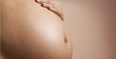 Photo of a pregnant person's belly