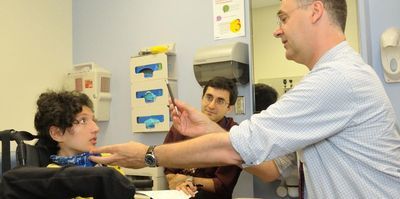 Scientists examining child patient