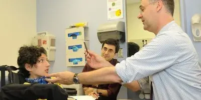 Scientists examining child patient