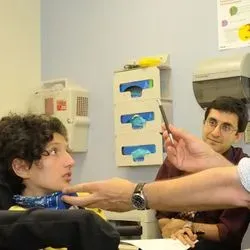 Scientists examining child patient