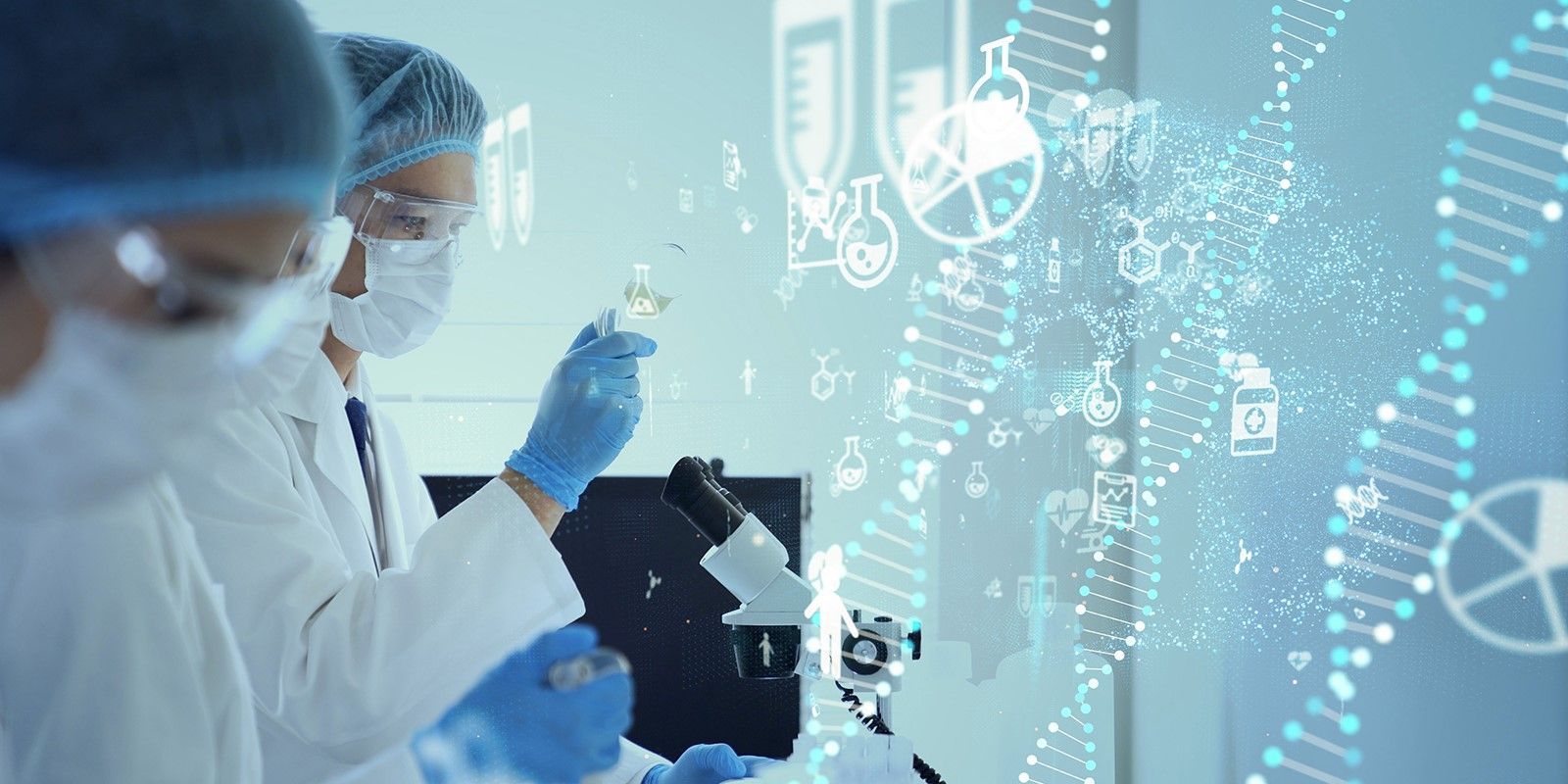 Researchers working with a microscope and personal protective equipment