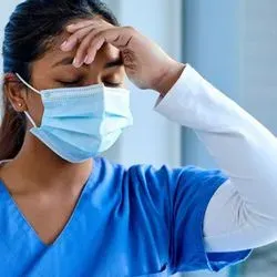 A primary care physician suffering exhaustion and burnout