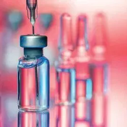 Photo of a syringe in a vaccine vial 