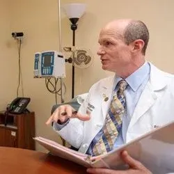 Randall Bateman, MD, director of the Dominantly Inherited Alzheimer Network-Trials Unit (DIAN-TU), an ongoing international clinical trial to evaluate experimental Alzheimer's drugs, speaks with DIAN-TU participant Taylor Hutton