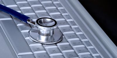 Stethoscope lying on computer keyboard