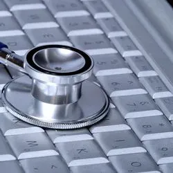 Stethoscope lying on computer keyboard