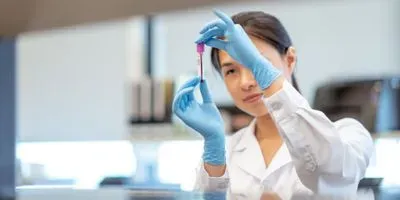 Researcher looking at blood sample