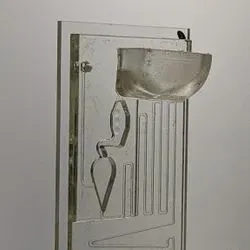 This point-of-care device uses the physics of fluids to draw a few drops of blood and biomedical lubricant through its components to test for COVID-19 antibodies and biomarkers without the need of any electricity.
