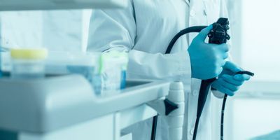 Doctor holding endoscpoe