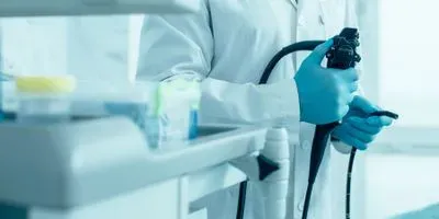 Doctor holding endoscpoe