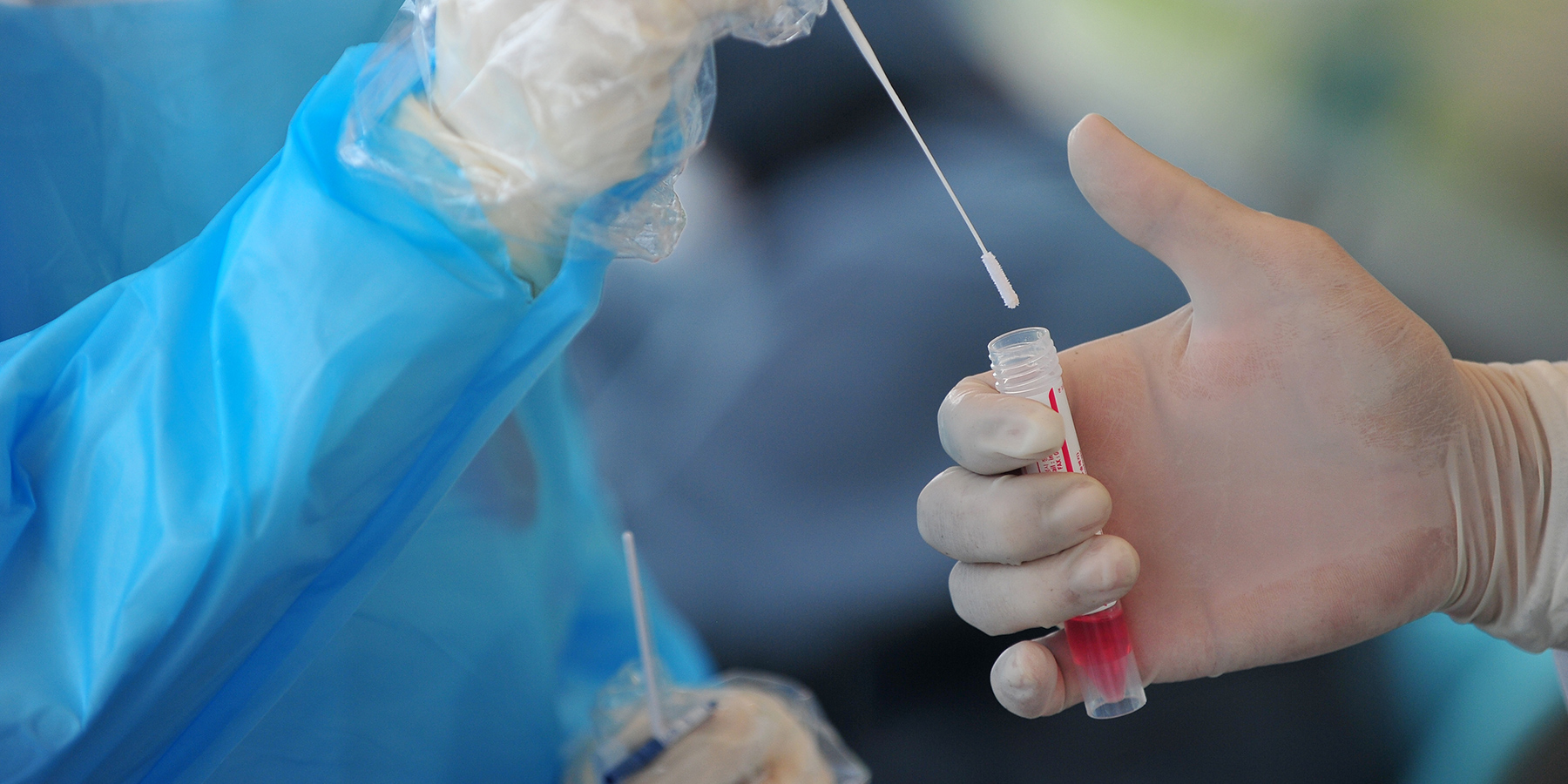 UCLA Scientists Say COVID-19 Test Offers Solution for Population-Wide Testing Doctors colletecing a COVID-19 test