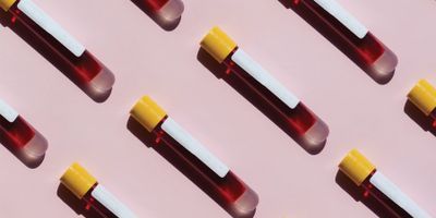 Illustration of blood collection tubes on a pink background