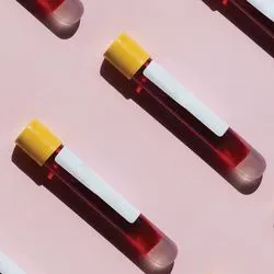 Illustration of blood collection tubes on a pink background