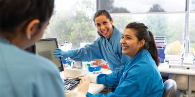 Photo of two laboratory professionals in the lab
