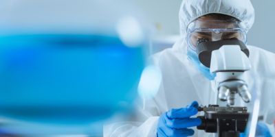 Researcher looking in microscope