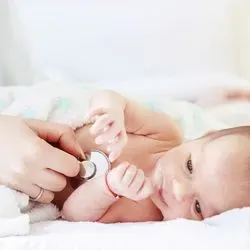 Baby being screend by a health care professional 