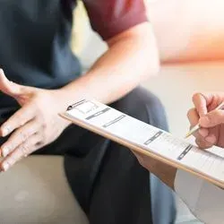 Image of a health care provider speaking with a patient 