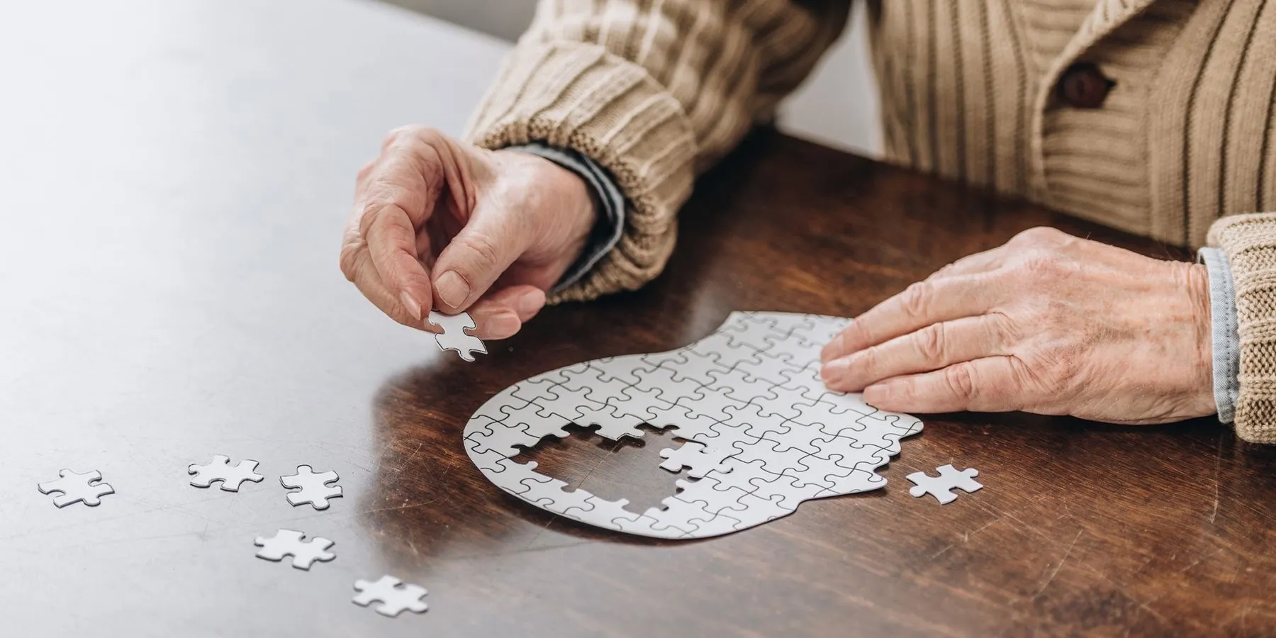 Image of elderly man working on a puzzle