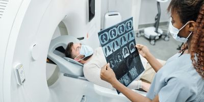 Medical professional looking at an MRI scan