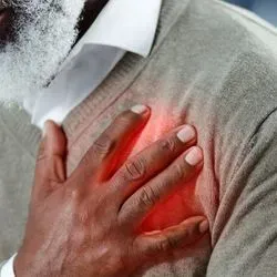 Image of a Black man having a heart attack