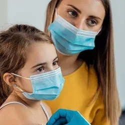 Mother and daughter getting vaccinated