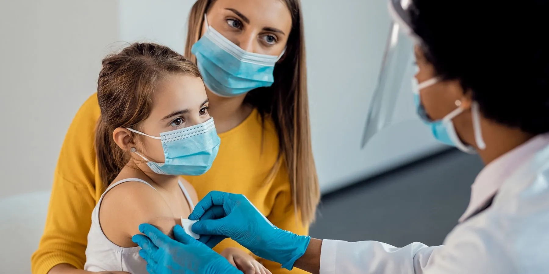Mother and daughter getting vaccinated