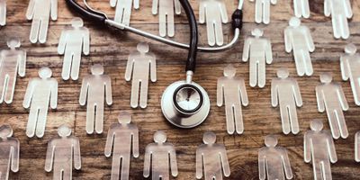 Stethescope and glass human figures 