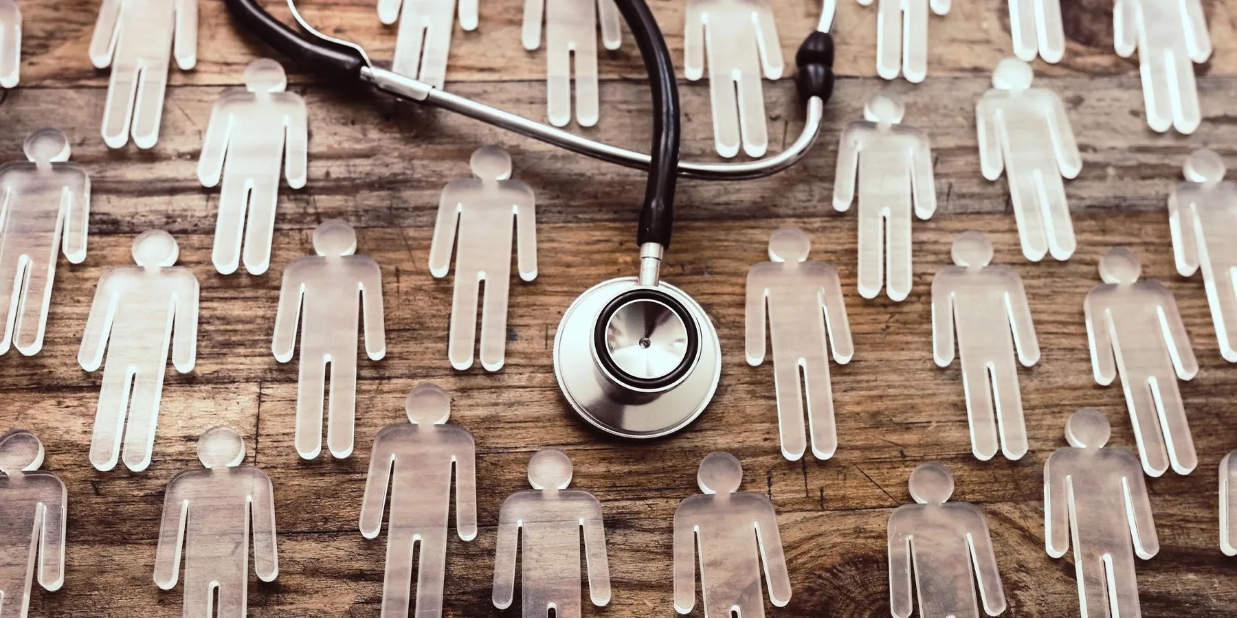 Stethescope and glass human figures 