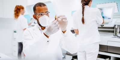 Male researcher examining a sample