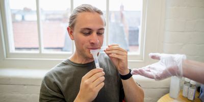 Man giving saliva sample