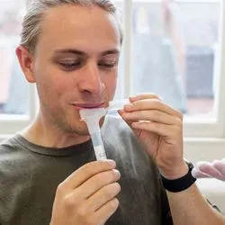 Man giving saliva sample
