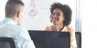 A clinical lab professional interviews a potential medical laboratory technologist candidate