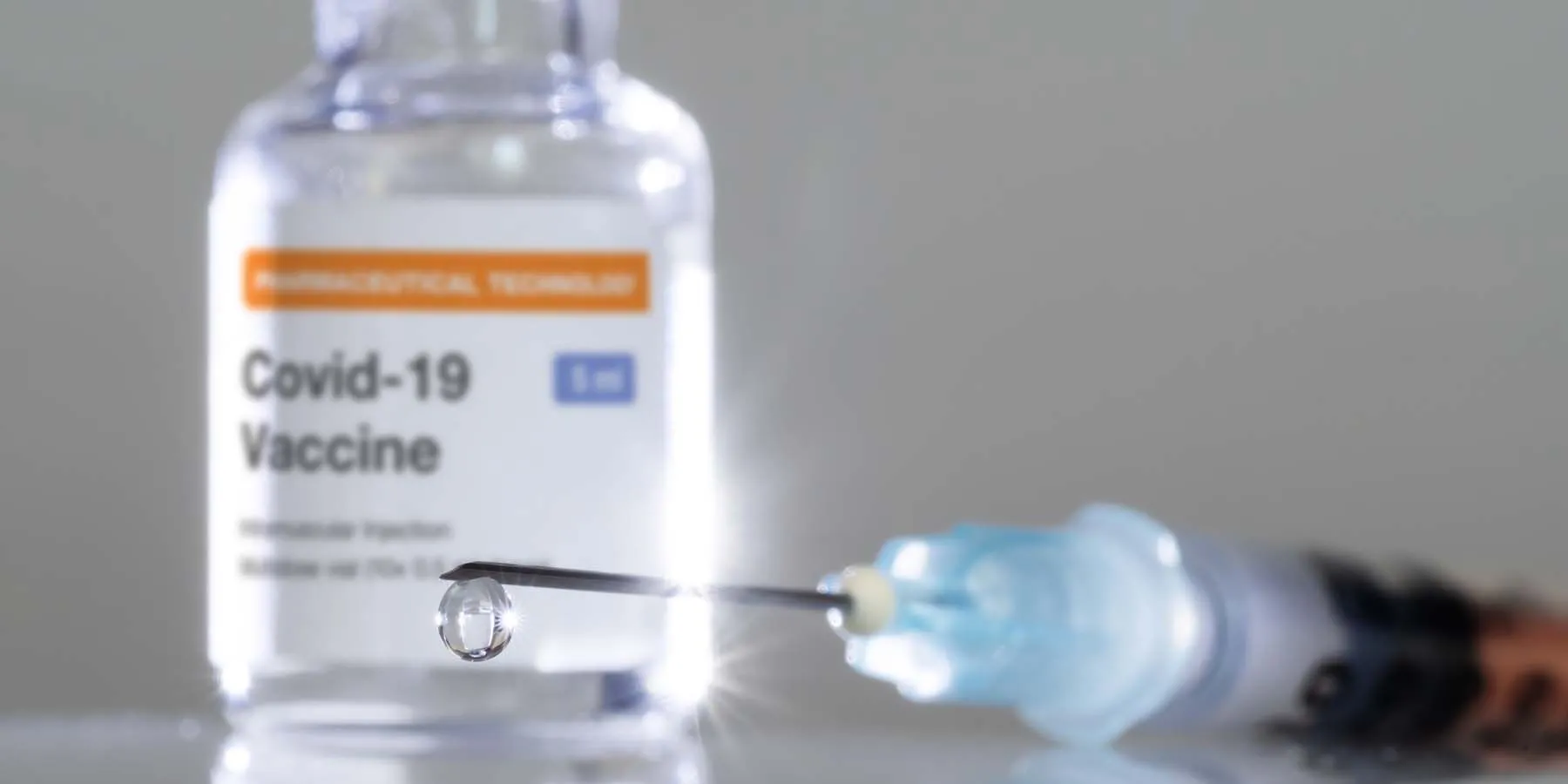 Study Launched of Extra COVID-19 Vaccine Dose in People with Autoimmune Disease A covid-19 vaccine bottle and needle